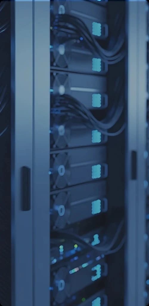 Data center aisle with illuminated server racks