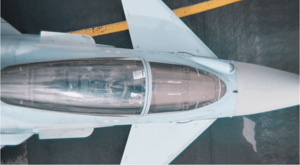 Overhead view of a fighter aircraft on the tarmac